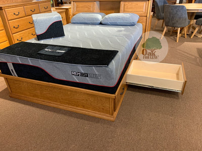 OD-O-T456 - Traditional Oak Pedestal Bed with 6 drawers pictured with a mattress and 2 pillows - 3/4 view with 1 drawer open - Oak For Less® Furniture