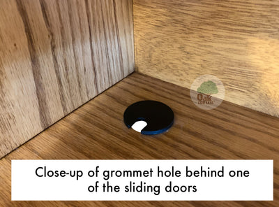 detail picture of a closeup of the grommet hole inside the back corner of the area behind one of the sliding doors of the OD-O-T462 - Traditional Oak Bookcase Headboard - Oak For Less® Furniture