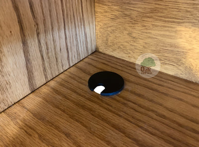 detail picture of a closeup of the grommet hole inside the back corner of the area behind one of the sliding doors of the OD-O-T462 - Traditional Oak Bookcase Headboard - Oak For Less® Furniture